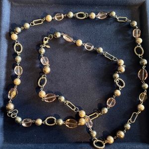 Long silver necklace with grey, pale pink and white beads